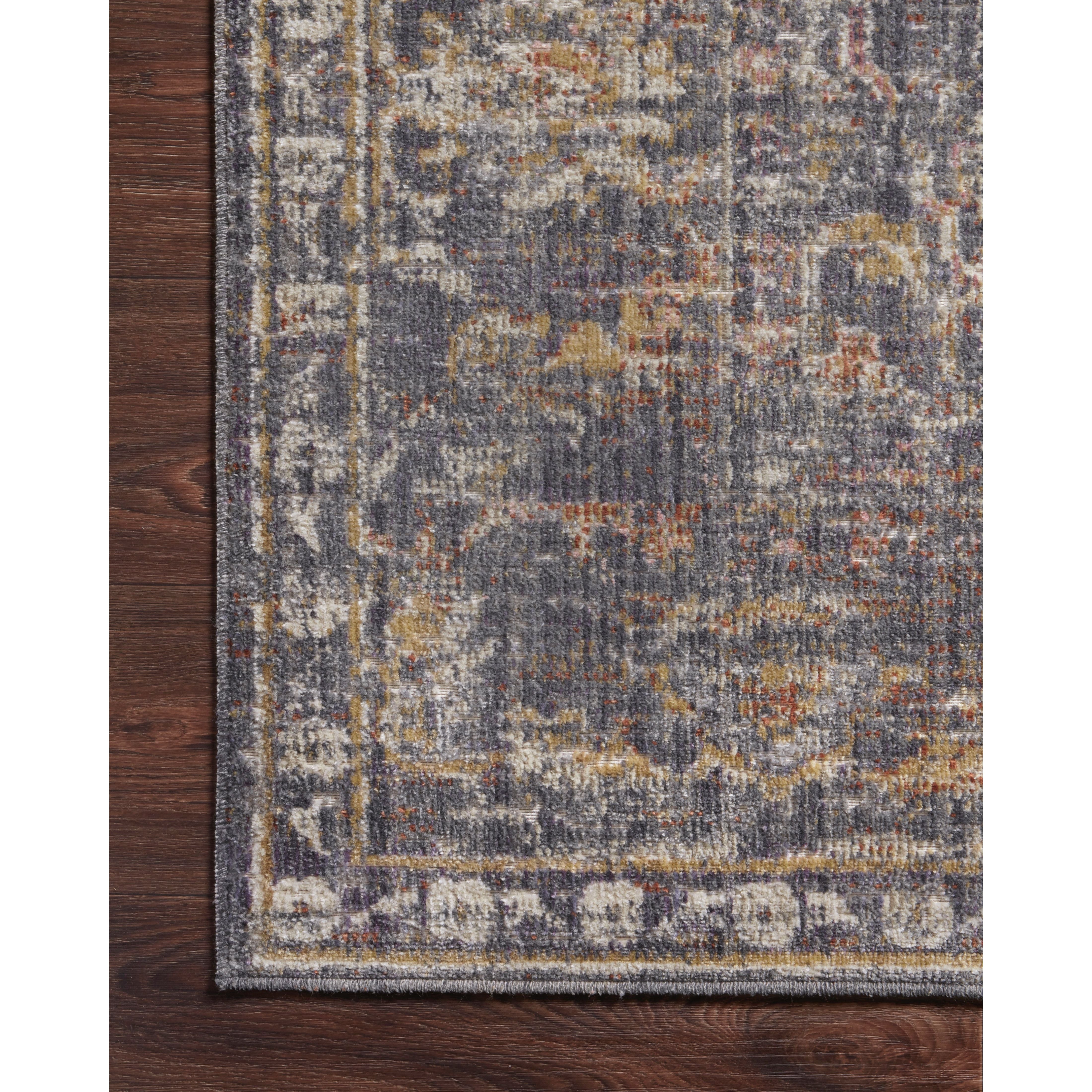 Durable, low pile, and soft, this rug is inspired by classic vintage and antique rugs. The Rosemarie Chris Loves Julia Graphite / Multi ROE-04 rug from Loloi features a beautiful vintage pattern and patina. The rug is easy to clean, never sheds, and perfect for living rooms, dining rooms, hallways, and kitchens!