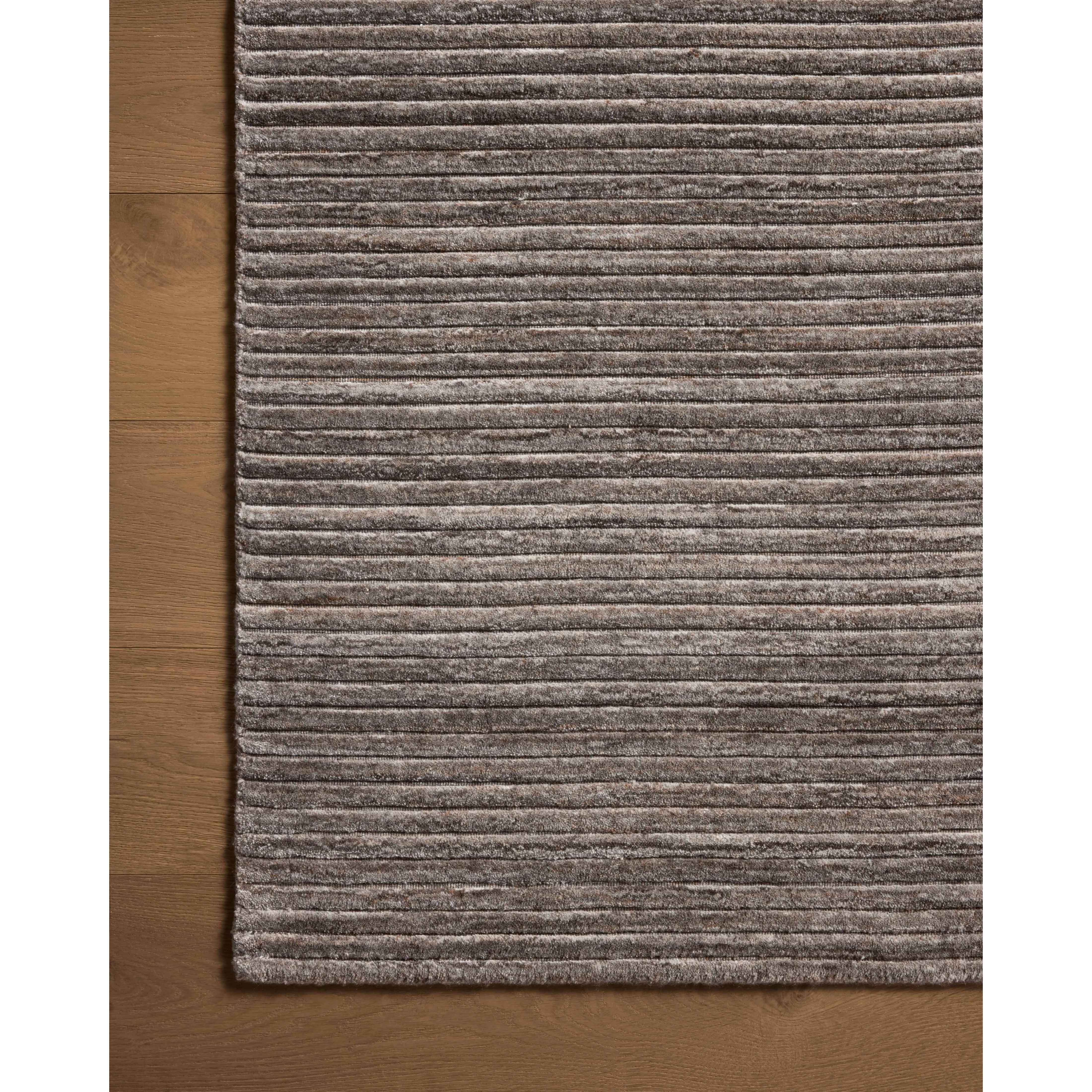 Sophisticated ribbing runs across the Sterling Collection, a nicely textured area rug with a natural color palette rich in tonality. Sterling is hand-loomed of polyester that's refreshingly easy to clean and withstands high-traffic in living rooms, dining rooms, or bedrooms. Amethyst Home provides interior design, new home construction design consulting, vintage area rugs, and lighting in the Boston metro area.