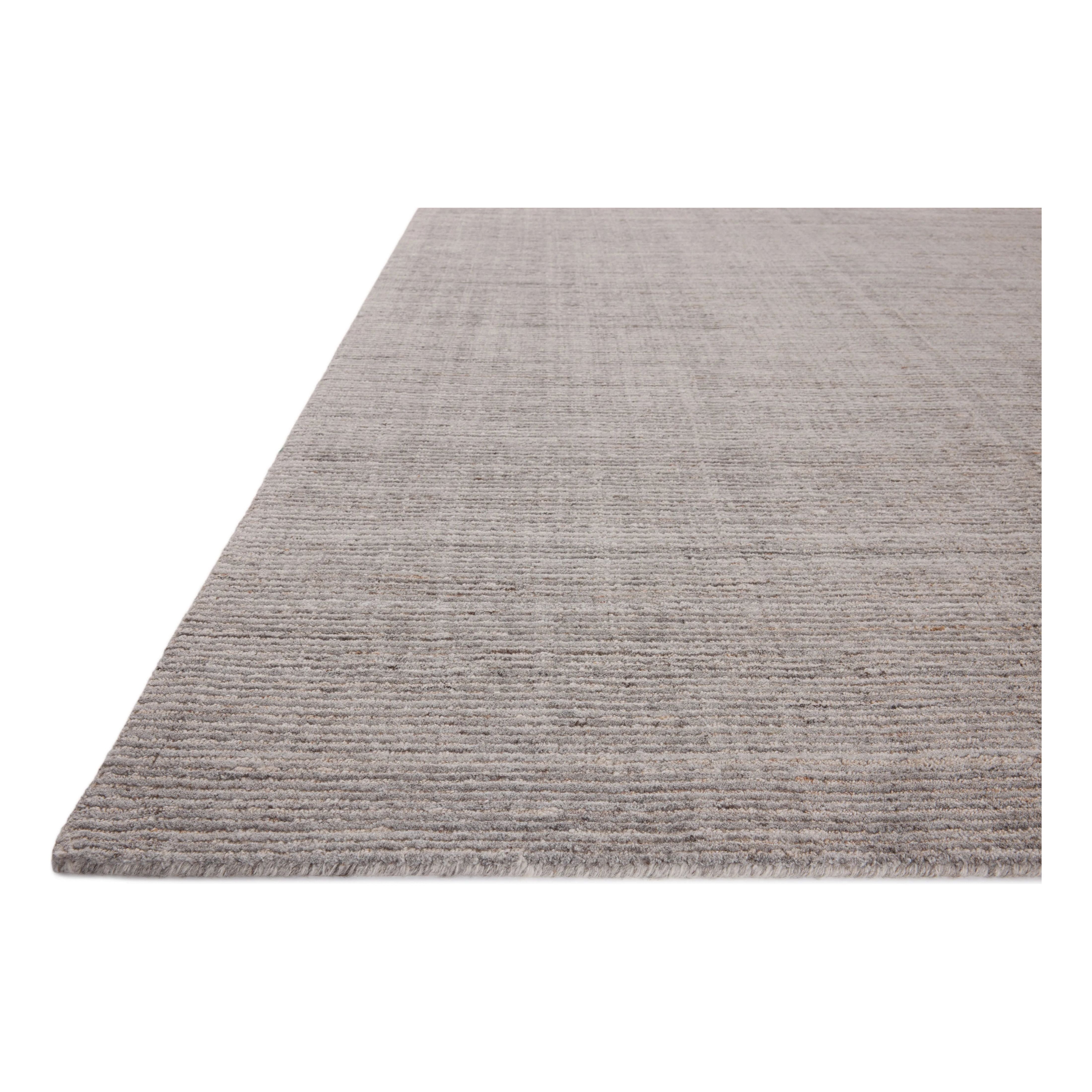 The Thorne Collection is a hand-loomed area rug with thin, textured lines. The rug's neutral, heathered tones add levity to living rooms, coziness to bedrooms, and casual warmth to dining rooms. Amethyst Home provides interior design, new home construction design consulting, vintage area rugs, and lighting in the Washington metro area.
