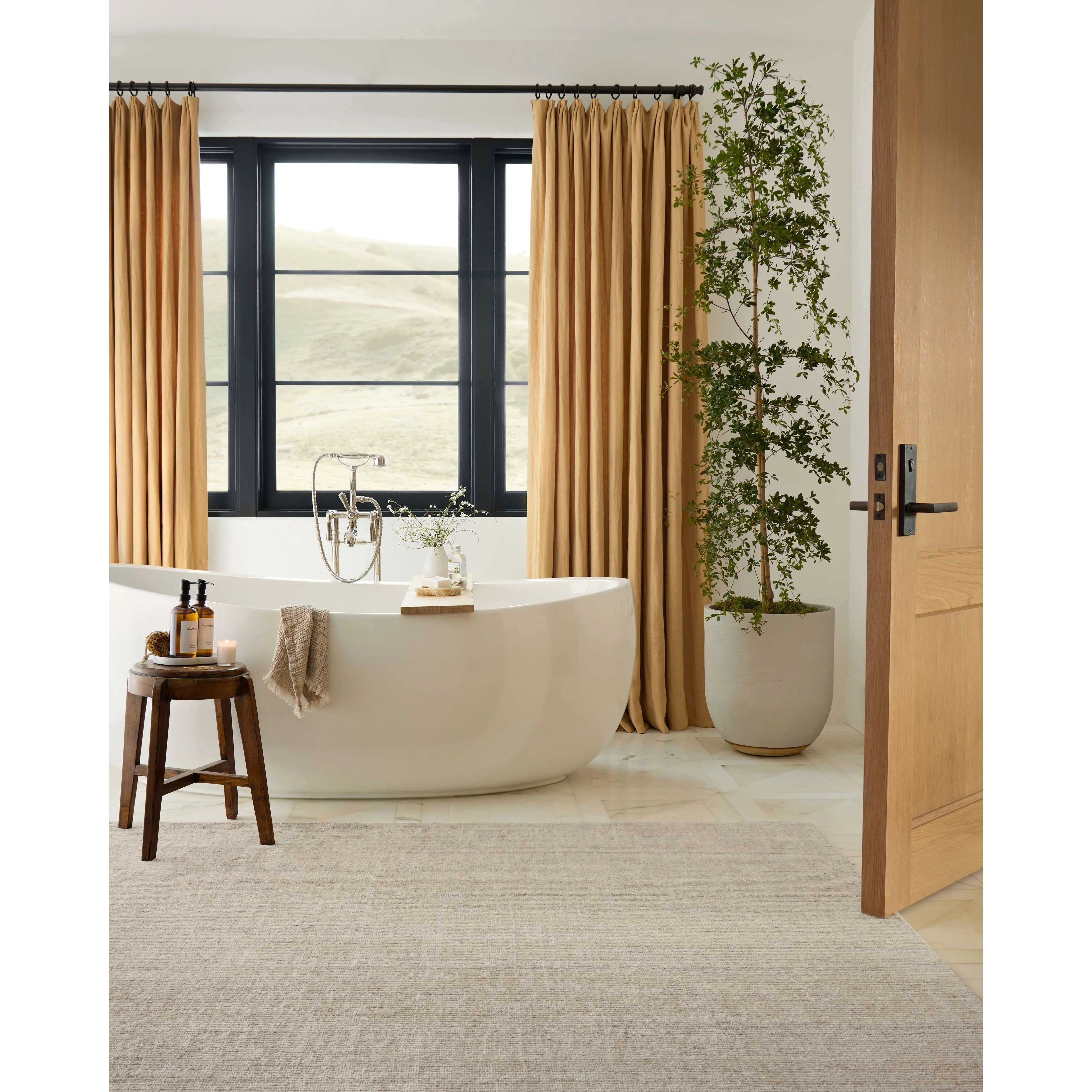 The Thorne Collection is a hand-loomed area rug with thin, textured lines. The rug's neutral, heathered tones add levity to living rooms, coziness to bedrooms, and casual warmth to dining rooms. Amethyst Home provides interior design, new home construction design consulting, vintage area rugs, and lighting in the Omaha metro area.