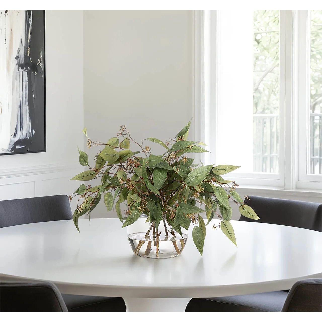 Create a luxurious atmosphere with this green Eucalyptus, housed in a glass vase. Reaching 19", it's a graceful addition that enhances small nooks, shelves, or bathroom vanities, adding a refined touch. Experience the charm of this arrangement, maintenance-free and ideal for those who love fresh, vibrant decor Amethyst Home provides interior design, new home construction design consulting, vintage area rugs, and lighting in the Park City metro area.