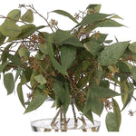 Create a luxurious atmosphere with this green Eucalyptus, housed in a glass vase. Reaching 19", it's a graceful addition that enhances small nooks, shelves, or bathroom vanities, adding a refined touch. Experience the charm of this arrangement, maintenance-free and ideal for those who love fresh, vibrant decor Amethyst Home provides interior design, new home construction design consulting, vintage area rugs, and lighting in the Tampa metro area.