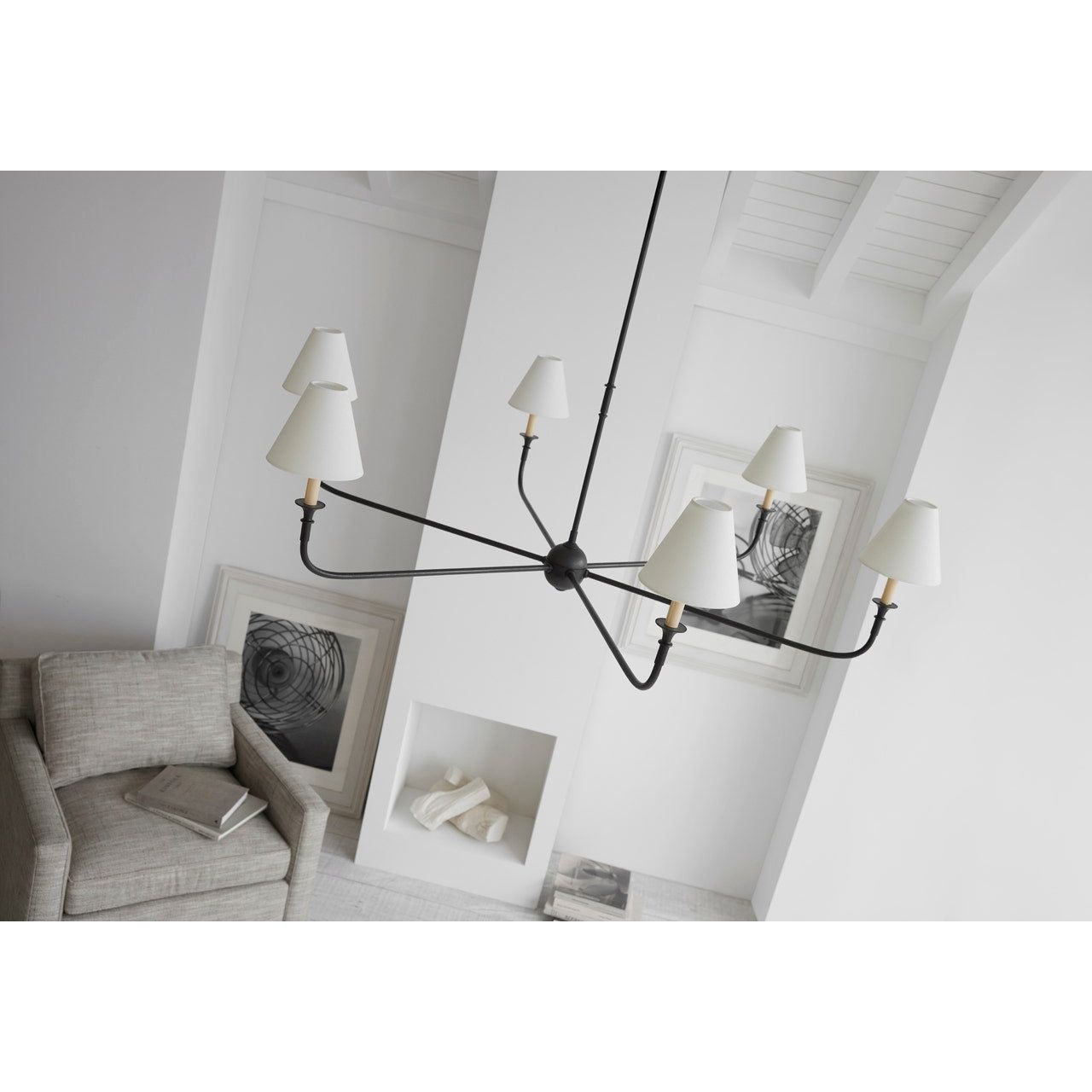 Featuring Piaf Grande Chandelier Aged Iron and Ebonized Oak by Visual Comfort at Amethyst Home. With the Piaf, Thomas O'Brien explores clean shapes with an airy feel. Natural steel bars intersect with wooden and metal hubs accented by simple candles and white conical shades. The juxtaposition of classic, casual forms with modern details will lend itself effortlessly to a diver. Amethyst Home provides interior design, new construction, custom furniture, and area rugs in the Newport Beach metro area