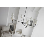 Featuring Piaf Grande Chandelier Aged Iron and Ebonized Oak by Visual Comfort at Amethyst Home. With the Piaf, Thomas O'Brien explores clean shapes with an airy feel. Natural steel bars intersect with wooden and metal hubs accented by simple candles and white conical shades. The juxtaposition of classic, casual forms with modern details will lend itself effortlessly to a diver. Amethyst Home provides interior design, new construction, custom furniture, and area rugs in the Newport Beach metro area