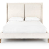 Featuring Potter Dover Crescent Bed by Four Hands at Amethyst Home. Welcome light, livable luxury into your bedroom with a fully upholstered bed. A tapered headboard features a fixed oversized cushion of high-performance fabric, creating a soft, layered look. Understated wooden legs complete the design. Performance fabrics are specially created to withsta. Amethyst Home provides interior design, new home construction design consulting, vintage area rugs, and lighting in the Los Angeles metro area.