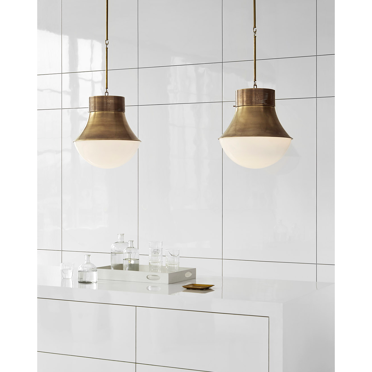 Featuring Precision Large Pendant Antique-Burnished Brass by Visual Comfort at Amethyst Home. Defined by its signature perforated metal, Kelly Wearstler's Precision series explores the harmonious relationship between light and form. Featuring bold architectural lines that range from minimalist silhouettes to statement shapes, the modern designs diffuse and reflect light to add. Amethyst Home provides interior design, new construction, custom furniture, and area rugs in the Newport Beach metro area