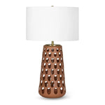 Natural light can filter through perforations on the base of the Kelvin Ceramic Table Lamp, creating a beautiful effect by day as much as it has while illuminated during the evening. Amethyst Home provides interior design, new home construction design consulting, vintage area rugs, and lighting in the Laguna Beach metro area.