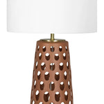 Natural light can filter through perforations on the base of the Kelvin Ceramic Table Lamp, creating a beautiful effect by day as much as it has while illuminated during the evening. Amethyst Home provides interior design, new home construction design consulting, vintage area rugs, and lighting in the Washington metro area.