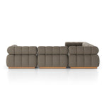 A modern take on mid-century Italian design, soft volume and exaggerated proportions fuse for a sculpted look and playful feel. Atop a plinth-style teak base, outdoor-friendly five-piece sectional features dramatic tufting for a padded sit, indoors and out. Amethyst Home provides interior design, new construction, custom furniture, and area rugs in the Miami metro area