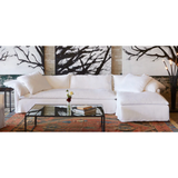 Wind down from a long day in this comfortable, easy-care slipcovered Donato White Slipcovered Linen Sectional with Chaise. This casual, chic sectional will bring the whole family together for years to come. Amethyst Home provides interior design, new home construction design consulting, vintage area rugs, and lighting in the Calabasas metro area.