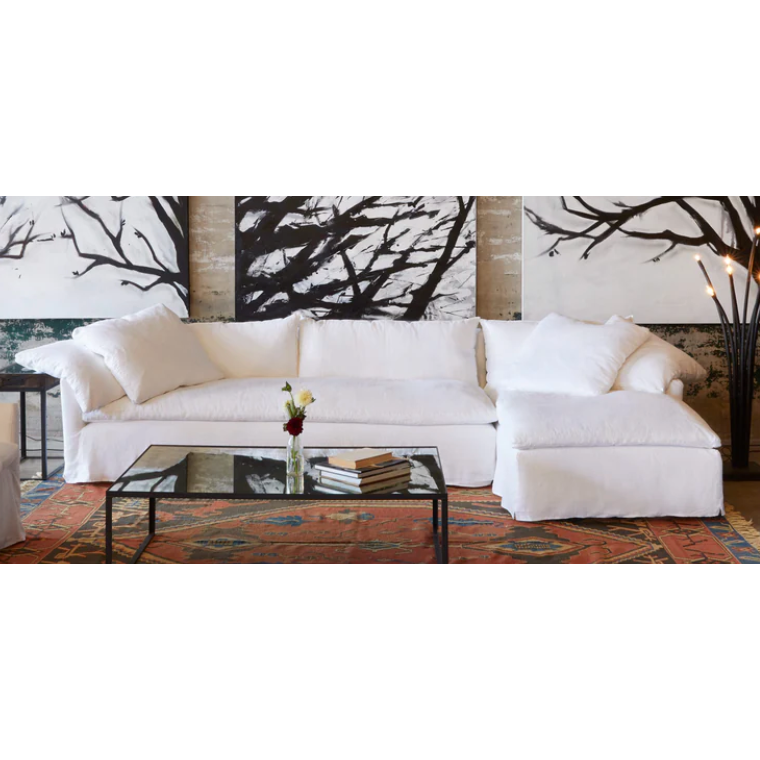 Wind down from a long day in this comfortable, easy-care slipcovered Donato White Slipcovered Linen Sectional with Chaise. This casual, chic sectional will bring the whole family together for years to come. Amethyst Home provides interior design, new home construction design consulting, vintage area rugs, and lighting in the Calabasas metro area.