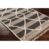 Bring a touch of global-inspired sophistication to your living space with the Cadiz Handmade Rug. This hand knotted wool rug has a plush pile, offering an inviting feel underfoot. The fringe detail adds texture and visual interest, while its Moroccan-style pattern gives this piece a timeless yet modern look. Amethyst Home provides interior design, new home construction design consulting, vintage area rugs, and lighting in the Des Moines metro area.