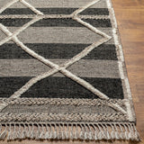 Bring a touch of global-inspired sophistication to your living space with the Cadiz Handmade Rug. This hand knotted wool rug has a plush pile, offering an inviting feel underfoot. The fringe detail adds texture and visual interest, while its Moroccan-style pattern gives this piece a timeless yet modern look. Amethyst Home provides interior design, new home construction design consulting, vintage area rugs, and lighting in the Nashville metro area.