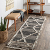 Bring a touch of global-inspired sophistication to your living space with the Cadiz Handmade Rug. This hand knotted wool rug has a plush pile, offering an inviting feel underfoot. The fringe detail adds texture and visual interest, while its Moroccan-style pattern gives this piece a timeless yet modern look. Amethyst Home provides interior design, new home construction design consulting, vintage area rugs, and lighting in the Park City metro area.