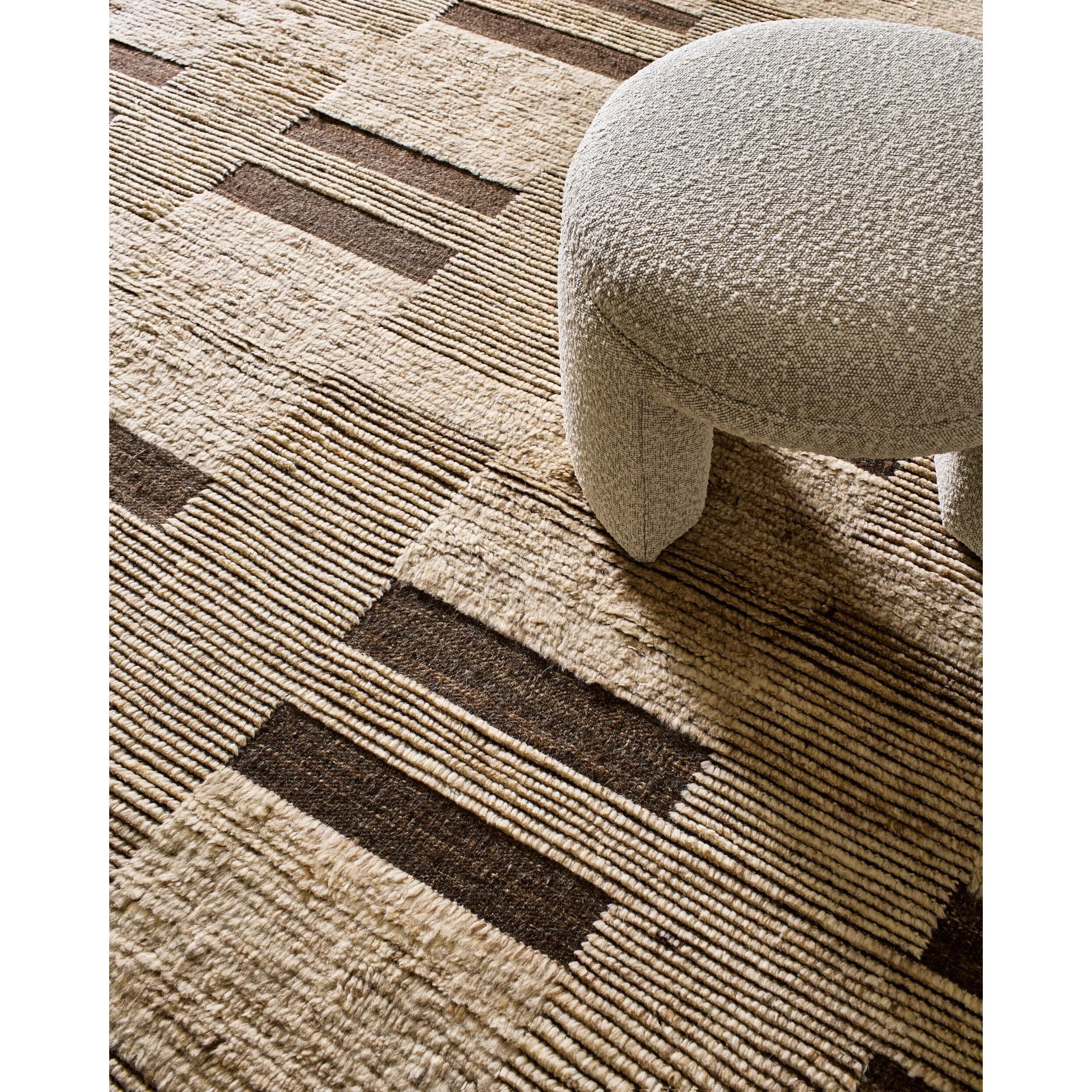 Elevate your living space with the Folklore handmade rug. Fashioned in an Art Deco Modern style, this Indian manufactured woolen wonder brings a unique flair to any room it graces. The hand-knotted construction promises high pile comfort underfoot, making every step a plush experience. Amethyst Home provides interior design, new home construction design consulting, vintage area rugs, and lighting in the Washington metro area.