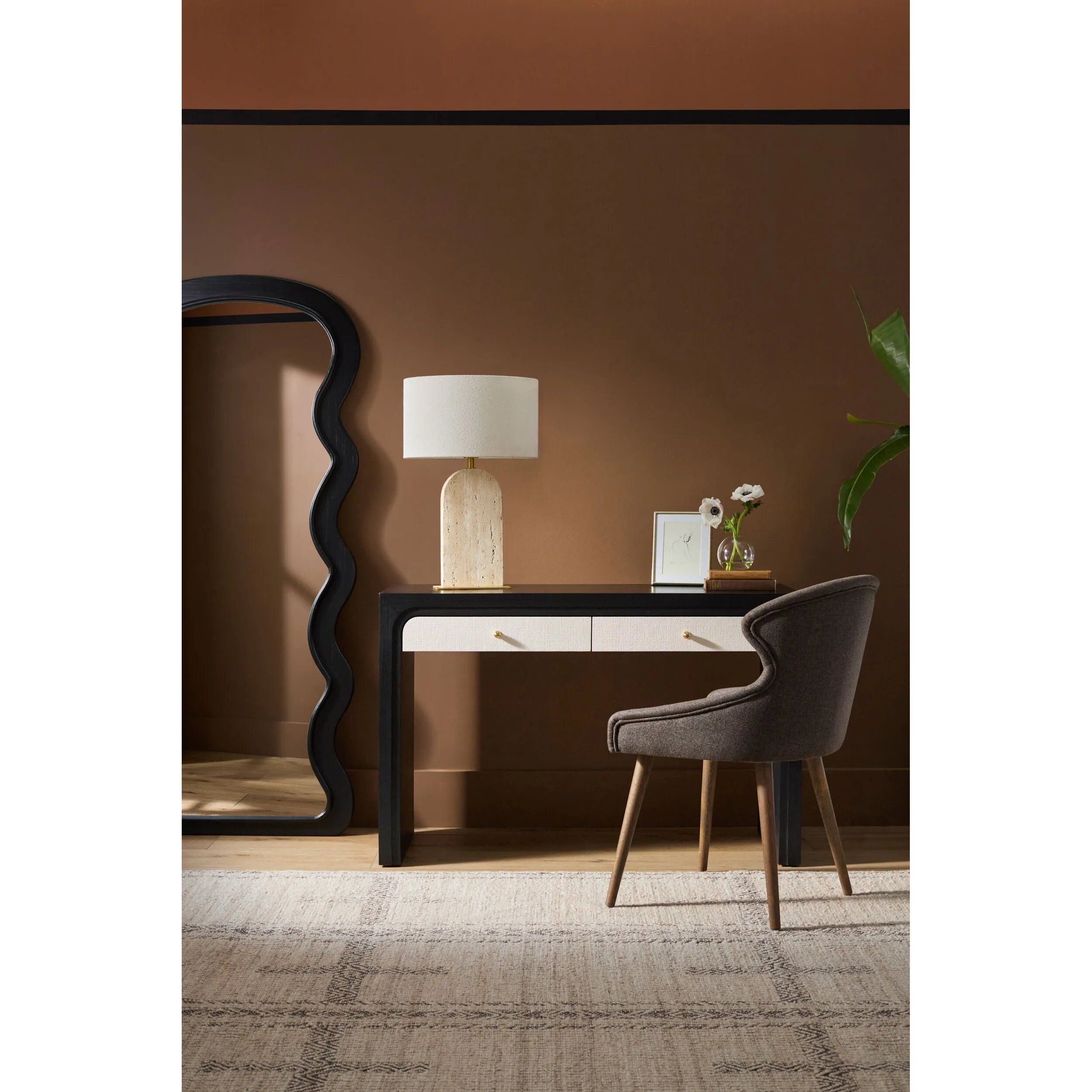 Step into a world of comfort and Bohemian charm with the Irfan handmade rug. Constructed in India, this handwoven rug is an exquisite blend of cotton and wool, offering exceptional durability along with a delightful underfoot feel. Its distinctive global style makes it a perfect centerpiece for any space that needs a dash of artistic flair. Amethyst Home provides interior design, new home construction design consulting, vintage area rugs, and lighting in the Austin metro area.