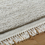 Introducing the Mabel Collection, where Country Cottage meets chic comfort. This handmade rug boasts a high pile construction, hand-woven from pure wool in the heartland of India, ensuring a plush and comfortable surface to walk on. It comes with an appealing fringe detail that adds a touch of rustic charm to any room. Amethyst Home provides interior design, new home construction design consulting, vintage area rugs, and lighting in the Dallas metro area.