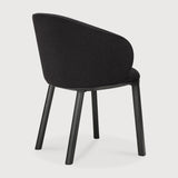 Featuring Unda Charcoal Oak Black Dining Chair by Ethnicraft at Amethyst Home. Experience dining comfort like never before with the Unda. Defined by its blend of materials, fluid lines and crafted piping trace the contours of the upholstered shell. Designed by Studio Segers, known for their pure and honest approach, every detail—down to the uniquely shaped legs—reflects sophistication. Amethyst Home provides interior design, new construction, custom furniture, and area rugs in the Omaha metro area
