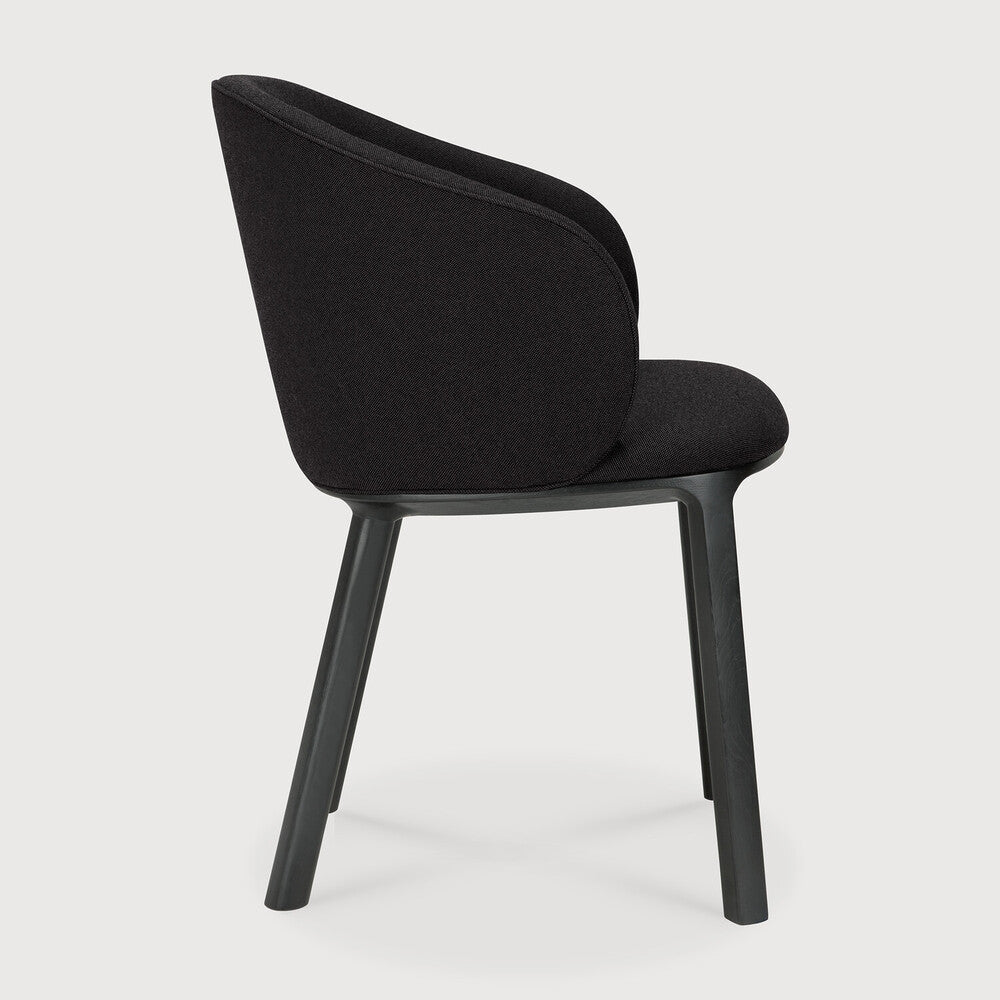 Featuring Unda Charcoal Oak Black Dining Chair by Ethnicraft at Amethyst Home. Experience dining comfort like never before with the Unda. Defined by its blend of materials, fluid lines and crafted piping trace the contours of the upholstered shell. Designed by Studio Segers, known for their pure and honest approach, every detail—down to the uniquely shaped legs—reflects sophistica. Amethyst Home provides interior design, new construction, custom furniture, and area rugs in the San Diego metro area