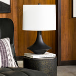 Featuring Brya Table Lamp by Surya at Amethyst Home. A touch of mid-century with a textured, interesting base -- the Bryant lamp is an Amethyst essential.
Overall Dimensions: 23"H x 12"W x 15"DSwitch Type: 3-WayNumber of bulbs: 1E-26/100 WUL CUL Certified.  Amethyst Home provides interior design, new home construction design consulting, vintage area rugs, and lighting in the Kansas City metro area.