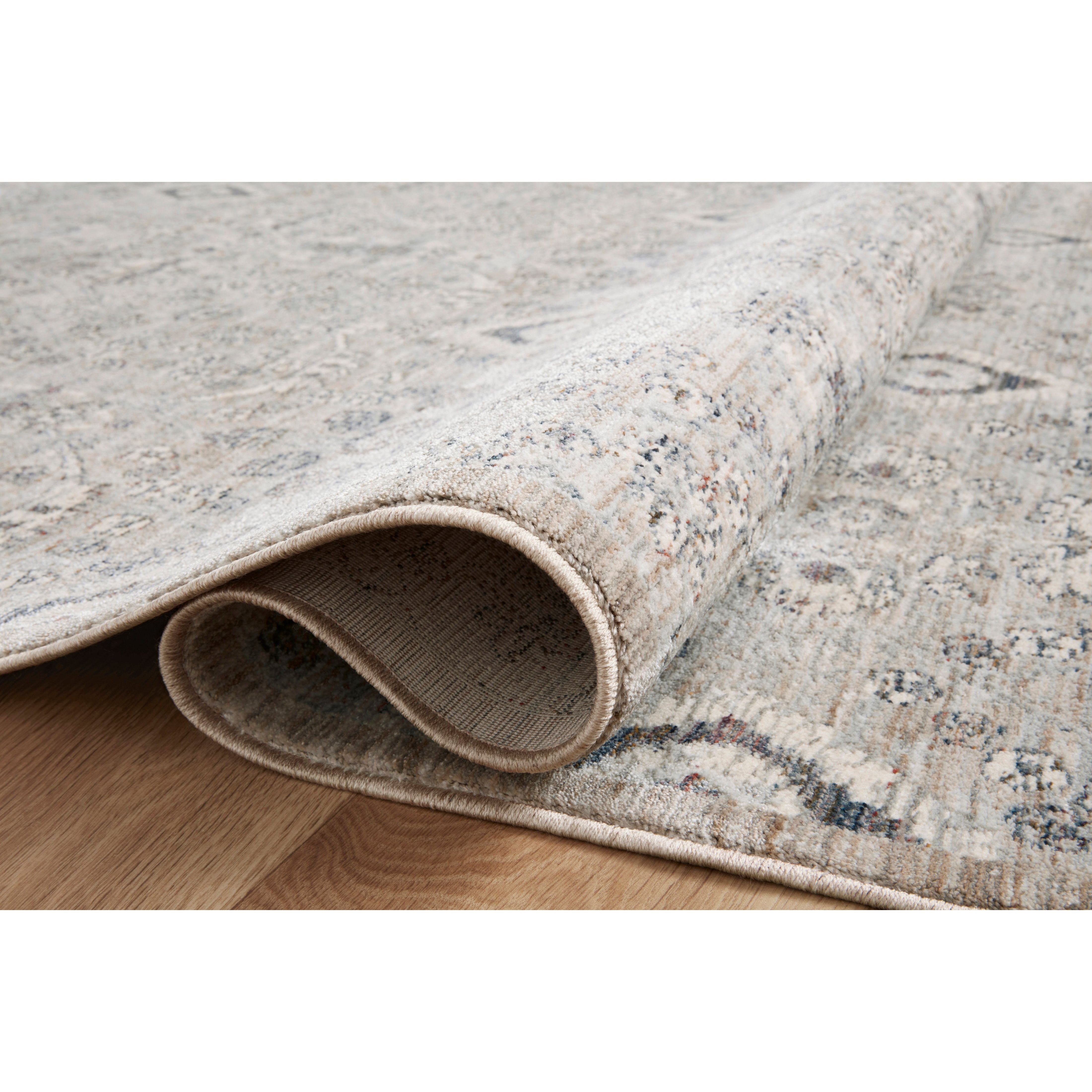Stain-resistant, fade-resistant, and long-lasting, the Zuma Collection for Amber Lewis x Loloi features a soft pile in a serene grey, blue and ivory palette. Zuma also carries the Okeo-Tex® label, ensuring the rug's materials do not contain harmful substances. Power Loomed 100% Polyester Pile ZUM-07 AL Silver / Sky
