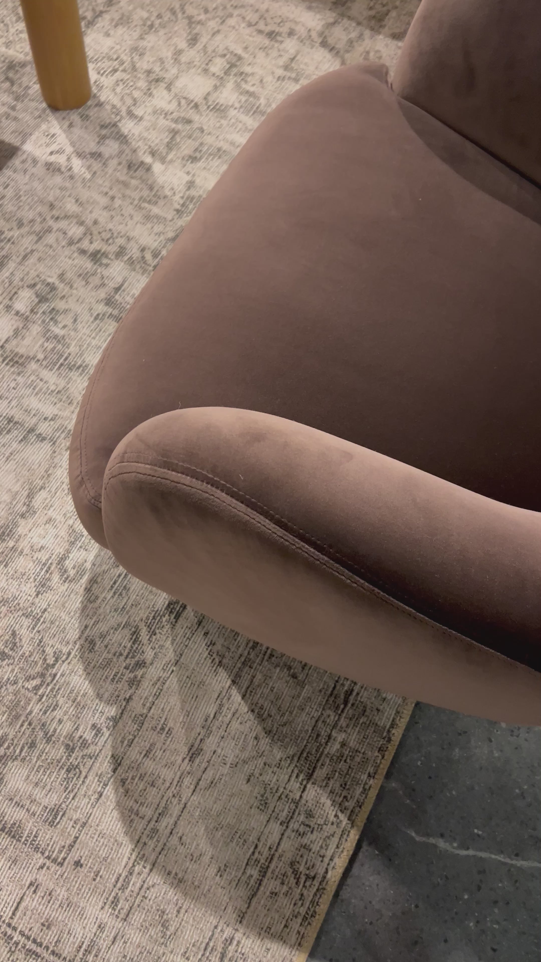 Load video: Velvety chocolate-brown upholstery pairs with an S-spring seat and enveloped frame for an inviting look and feel on this 360-degree swivel chair. Amethyst Home provides interior design, new home construction design consulting, vintage area rugs, and lighting in the Winter Garden metro area.
