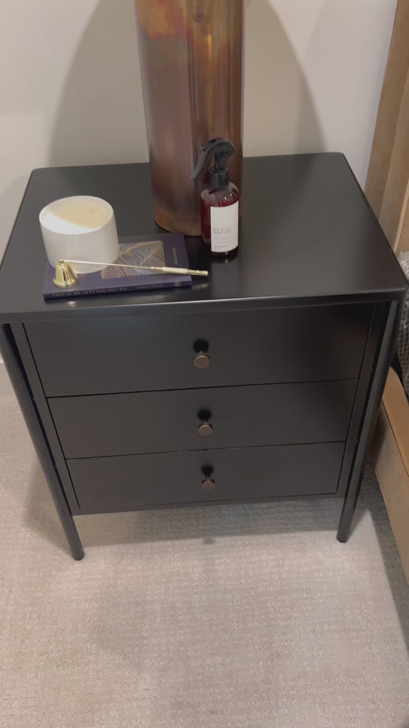 Bring a clean, beautifully industrial look to the bedroom with a three-drawer dresser made from black-finished iron, featuring bronzed iron hardware. Amethyst Home provides interior design, new home construction design consulting, vintage area rugs, and lighting in the Dallas metro area.
