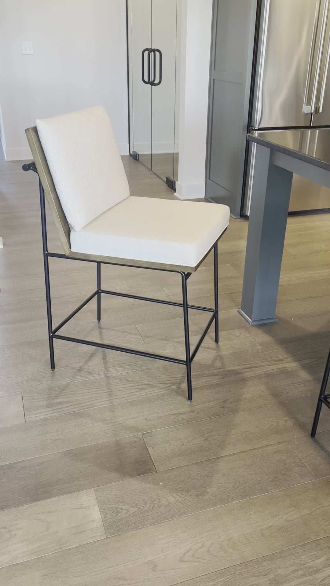 Fall in love with the back detailing of the Ross -- and stay for the comfort.  Beautiful iron base and wood details make this an unforgettable stool.Materials: Solid Oak, Iron, 92% Pl, 8% Li Amethyst Home provides interior design, new home construction design consulting, vintage area rugs, and lighting in the Newport Beach metro area.