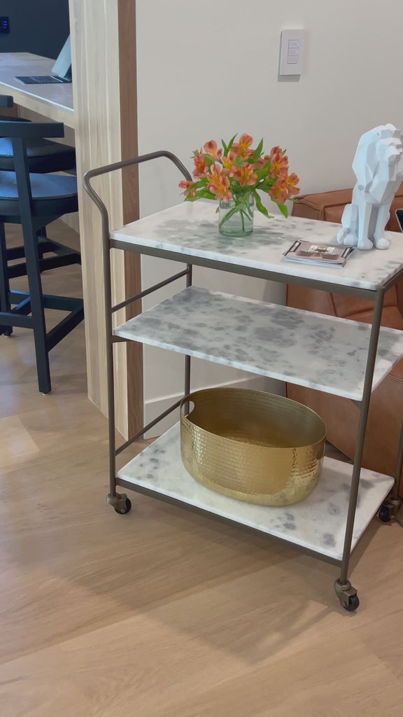 Entertain with style.  Beautiful natural marble shelves with a brass frame instantly infuses your space with style.Overall Dimensions: 30.00"w x 16.00"d x 36.25"hWeight : 85.98 lbsMaterials : Iron, Solid Marble Amethyst Home provides interior design, new home construction design consulting, vintage area rugs, and lighting in the Calabasas metro area.