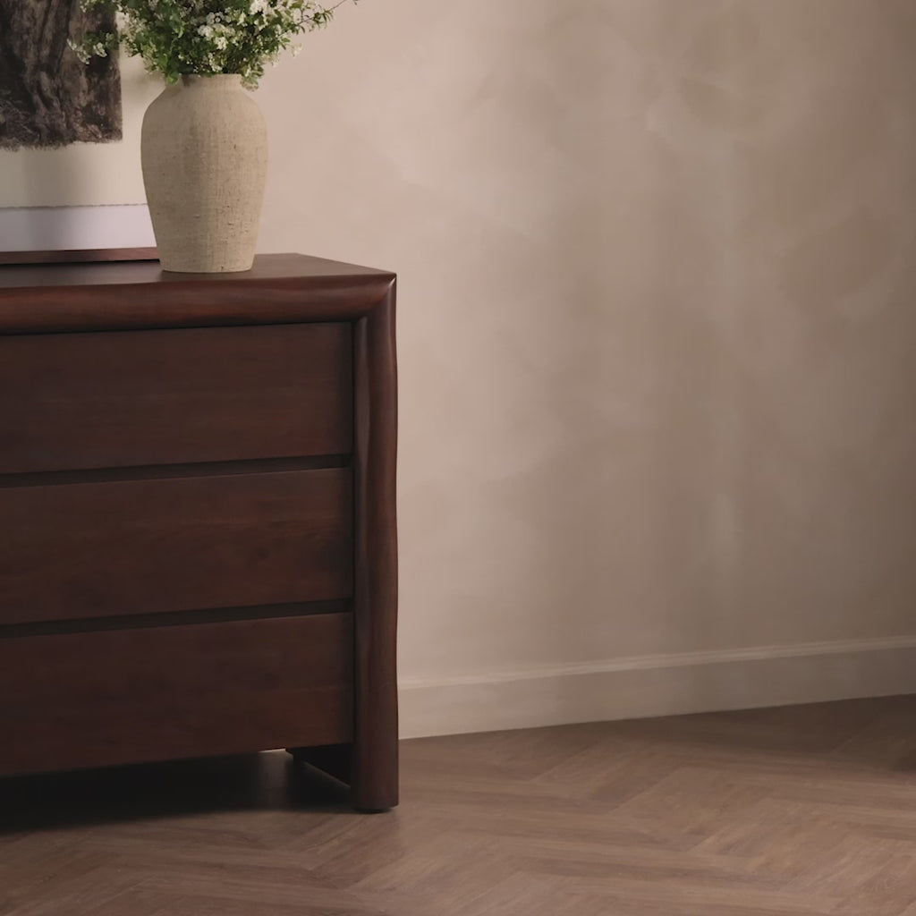 Made from solid acacia and finished in a rustic brown, a six-drawer, waterfall-shaped dresser features soft volume, mitered corners and a faux live edge.Overall Dimensions: 69.50"w x 20.00"d x 35.25"hWeight : 278.22 lbsMaterials : Solid Acacia Amethyst Home provides interior design, new home construction design consulting, vintage area rugs, and lighting in the Park City metro area.