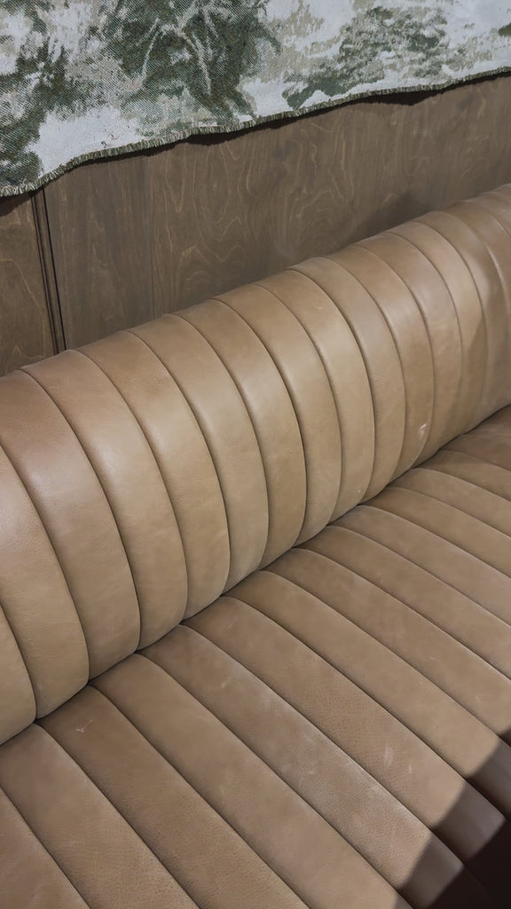 The armless dining bench is elevated with tan top-grain leather with a beautifully pronounced grain, plus dramatic channeling for a linear look. Perfectly sized for larger tables or spaces.Overall Dimensions:49" Bench: 49.00"w x 28.00"d x 31.50"hChair: 25.00"w x 28.00"d x 31.50"hCorner Chair: 28.00"w x 28.00"d x 31.50"hChair + A Half: 38.50"w x 28.00"d x 31. Amethyst Home provides interior design, new home construction design consulting, vintage area rugs, and lighting in the Scottsdale metro area.