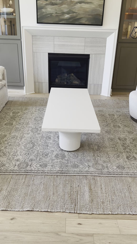 Make a monolithic statement with this Parra Coffee Table - Plaster Molded Concrete. Made from plaster-molded concrete, the pedestal-style legs support a rectangular tabletop of smooth, white-finished concrete, for a clean, adobe-inspired look. Amethyst Home provides interior design, new home construction design consulting, vintage area rugs, and lighting in the Calabasas metro area.