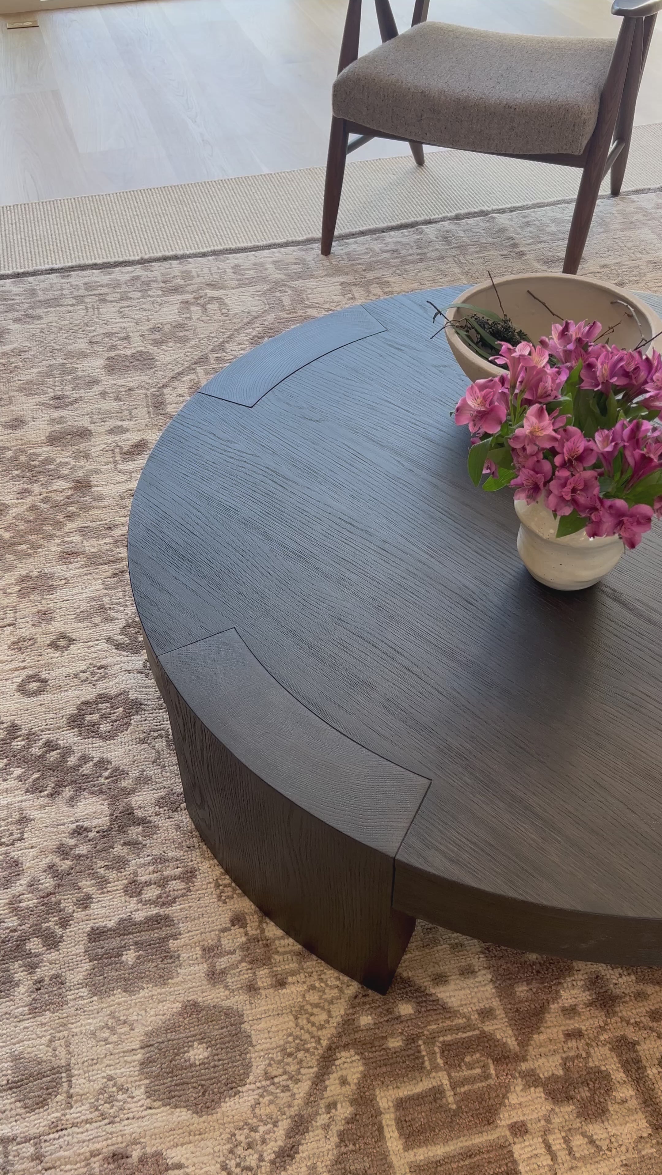 Made from thick, charcoal-finished oak, a rounded coffee table features four legs that pull through to the top, for an intriguing design detail.Overall Dimensions: 48.00"w x 48.00"d x 13.00"hWeight : 94.80 lbsMaterials : Oak Veneer Amethyst Home provides interior design, new home construction design consulting, vintage area rugs, and lighting in the Winter Garden metro area.