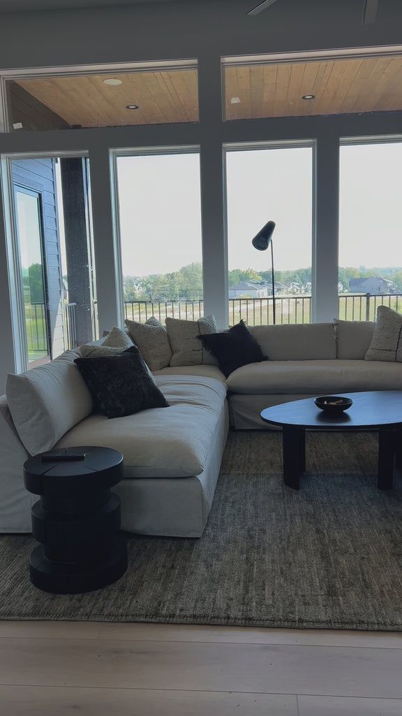 A new slipcovered version to a classic silhouette. A streamlined sectional is topped in a fully removable slipcover crafted from a soft linen/cotton/poly blend. Subtle texture throughout brings a casual coastal look and movement to the entire piece. Amethyst Home provides interior design, new home construction design consulting, vintage area rugs, and lighting in the Omaha metro area.