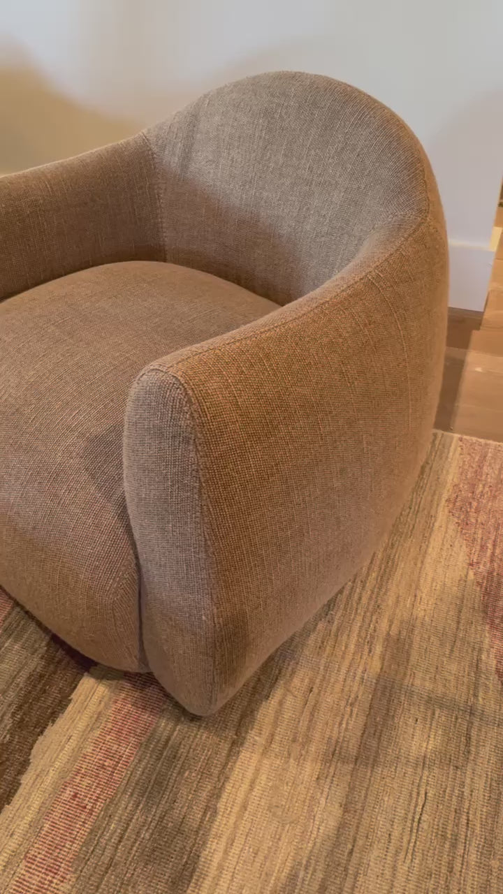 Load video: A delightfully, unexpected shape -- the Mina Swivel Chair is an Amethyst favorite.  It&#39;s gently curves define a space. Amethyst Home provides interior design, new home construction design consulting, vintage area rugs, and lighting in the Winter Garden metro area.