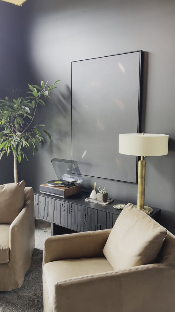 Raised between Ethiopia, Malawi, Togo and South Africa, the now-Austinite's rich upbringing can be sensed in her culture-rich works. A moody canvas is accented with warm swaths of paint. Framed within black maple for a gallery-quality look. Handmade in Austin, Texas. Amethyst Home provides interior design, new home construction design consulting, vintage area rugs, and lighting in the Nashville metro area.
