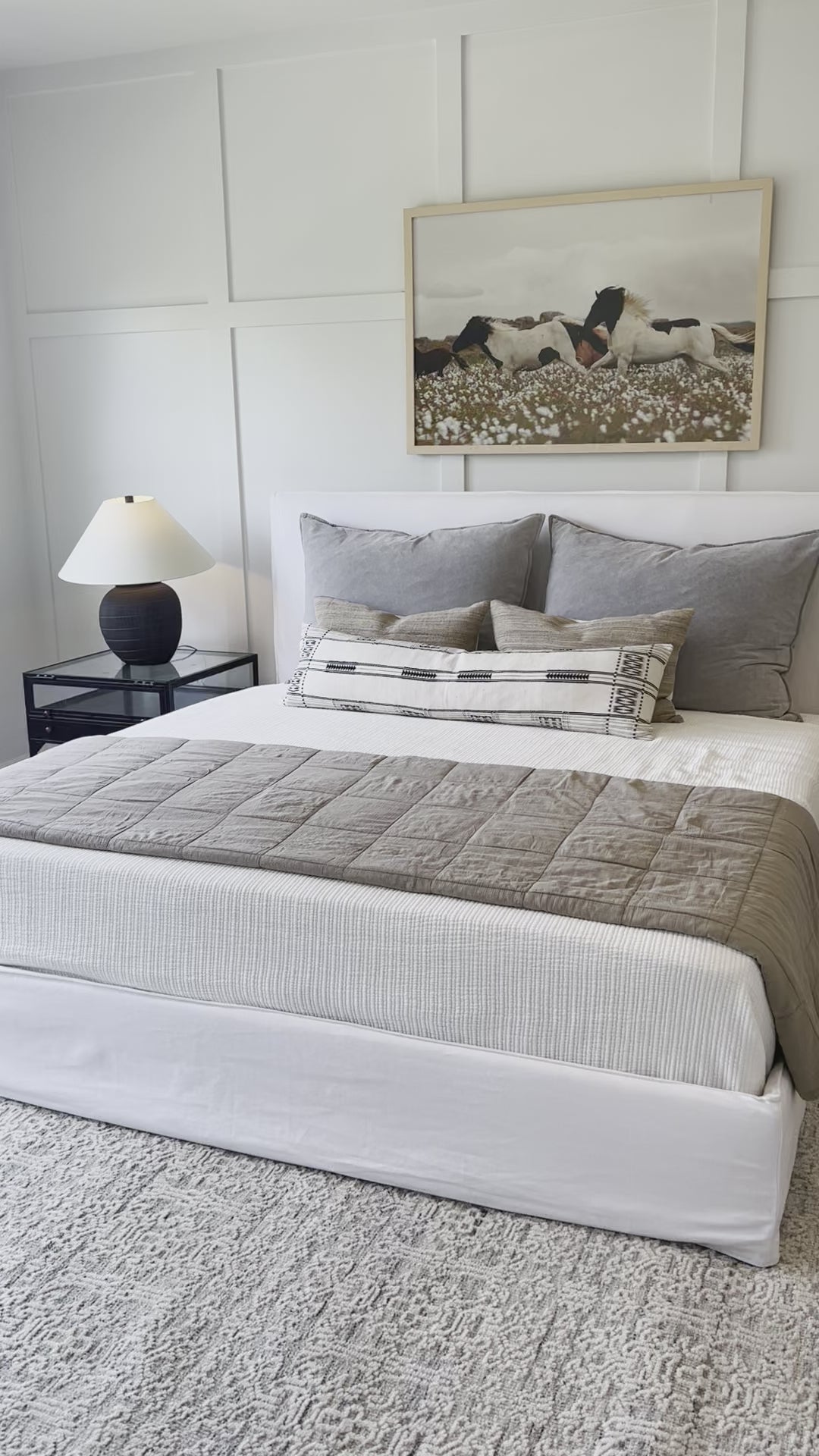 Load video: Cisco Brothers April Bed is designed and constructed in Los Angeles. The pinched edges and clean lines bring a modern, minimalist feel to any bedroom. Photographed in White Denim and Bengal Pin Striped Indigo. Amethyst Home provides interior design, new home construction design consulting, vintage area rugs, and lighting in the Newport Beach metro area.