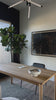 Raised between Ethiopia, Malawi, Togo, and South Africa, the now-Austinite's worldly upbringing can be sensed in her culture-rich works. A moody landscape is beautifully captured and enhanced with a texture-rich varnish. Framed within black maple. Handmade in Austin, Texas. Amethyst Home provides interior design, new home construction design consulting, vintage area rugs, and lighting in the Kansas City metro area.