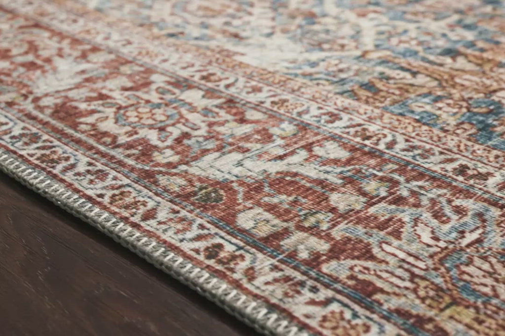 The Layla Collection is traditional and timeless, with a beautiful lived-in design that captures the spirit of an old-world rug. This traditional power-loomed rug is crafted of 100% polyester with a classic and sophisticated color palette and subtle patina.  Power Loomed 100% Polyester LAY-04 Ocean/Rust