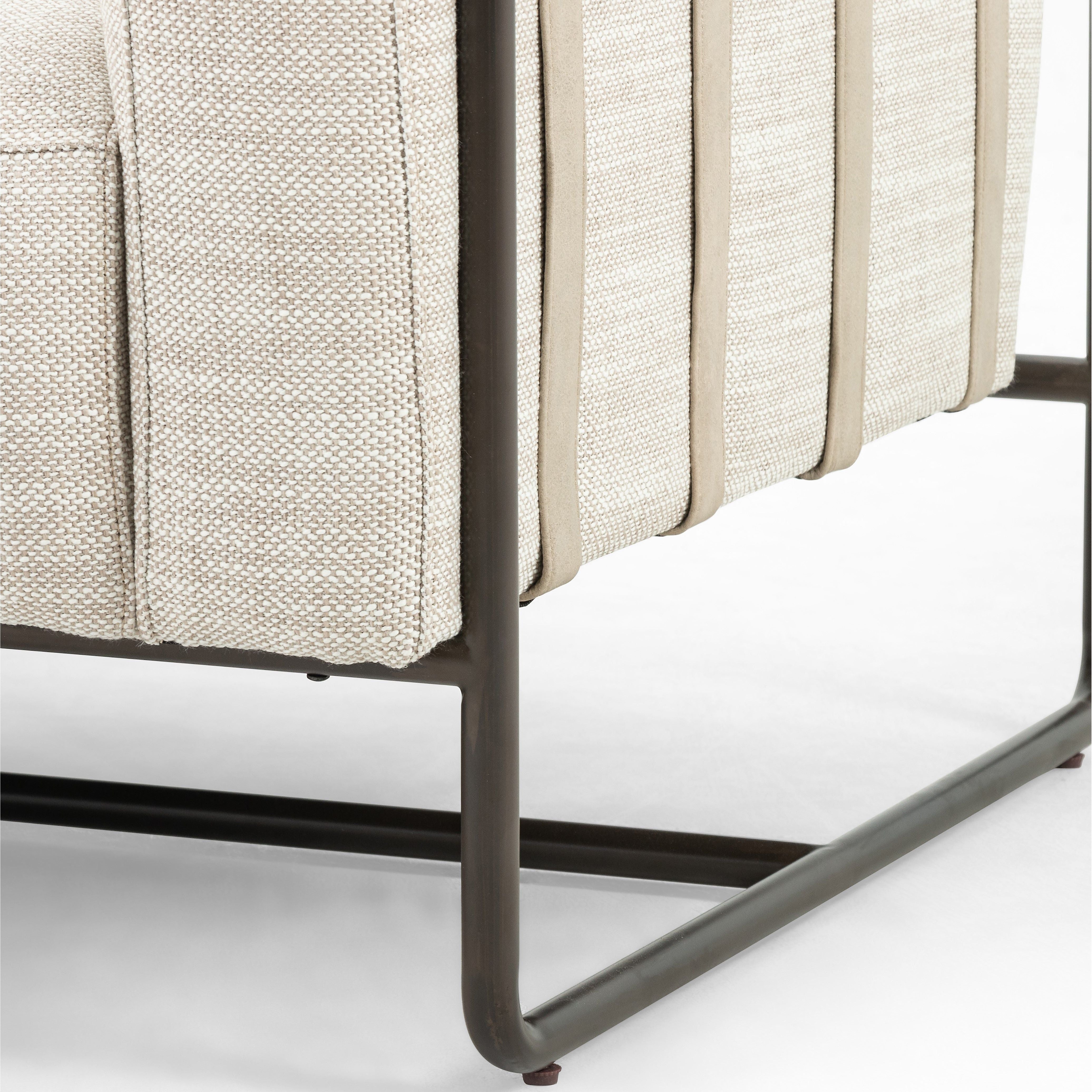 Neutral gone novel with this Ella Gable Taupe 91" Sofa. Taupe-colored upholstered seating is suspended by top-grain leather straps with handcrafted fastens, for an airy look. Solid rubberwood paneling wraps the frame’s entirety, while a black iron base lends lightness and contrast.  Available early October 2020!  Overall Dimensions: 91.00"w x 37.50"d x 30.25"h Materials: 82% Pl 16% Pc 2%Wo, Iron, 100% Top Grain Leath, Solid Parawood