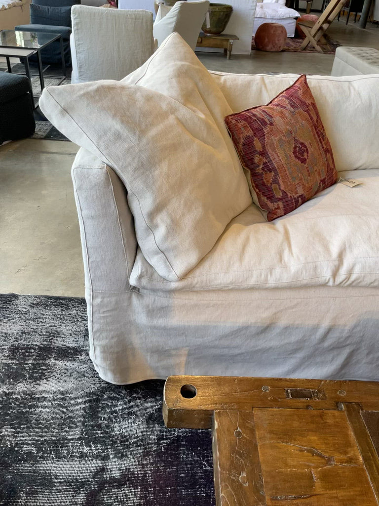 This cozy Havana Sofa from Cisco Brothers is a wonderful addition to any room. The sofa features a gorgeous rounded frame with a slight taper to the front. This was instant swoon when we saw this at market. As shown slipcovered in Mariet White 100% linen fabric.   108"w x 35"d x 30"h  Seat Space: 96"w x 22"d x 20"h