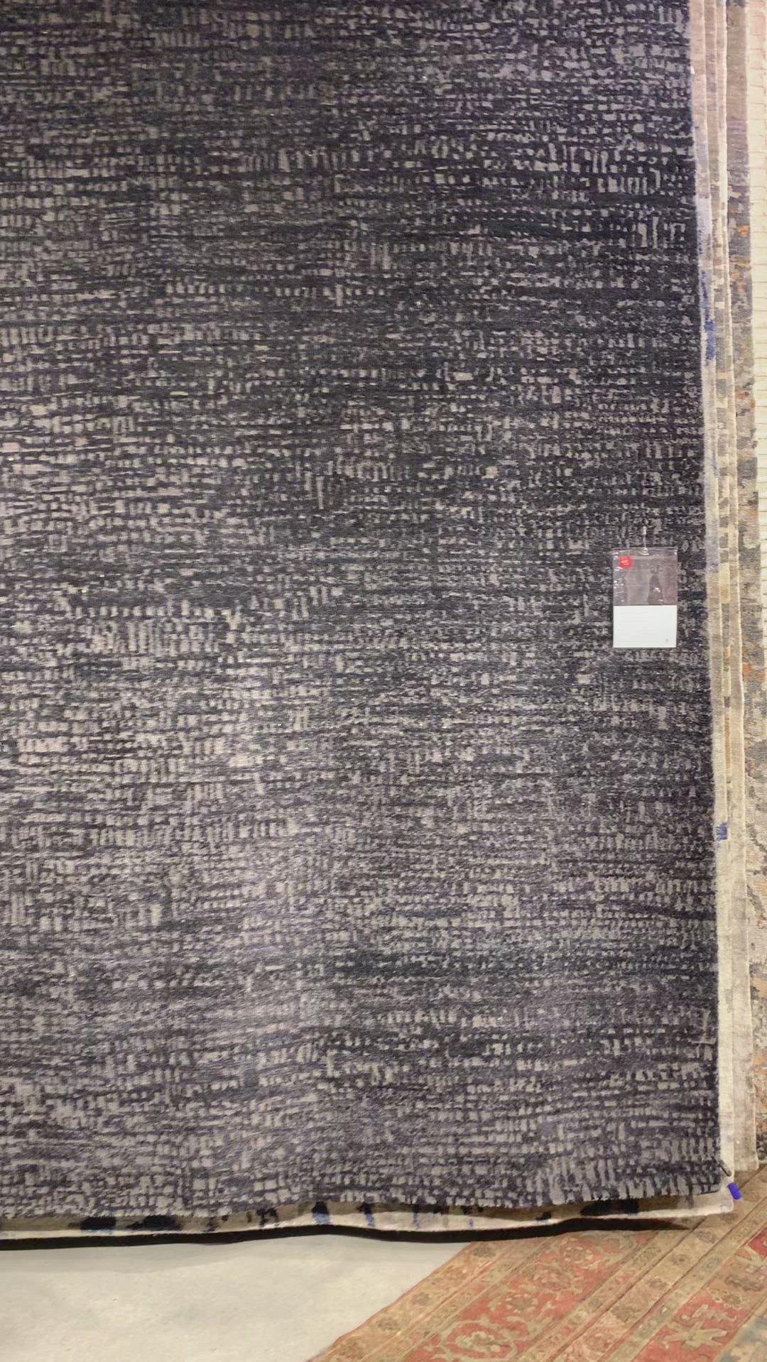 The Atlas Black / Bark Area Rug by Loloi, or ATL-05, showcases striking contemporary patterns with a sophisticated color palette. Bold yet approachable, Atlas' muted linear designs create a sense of refined movement. Hand Knotted. Wool | Nylon