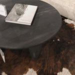 We love the shapely, substantial legs that support a slim, rounded tabletop of light black-finished reclaimed woods in this Maricopa Coffee Table - Dark Totem. A global, organic look with a handcrafted vibe.
