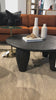 We love the shapely, substantial legs that support a slim, rounded tabletop of light black-finished reclaimed woods in this Maricopa Coffee Table - Dark Totem. A global, organic look with a handcrafted vibe.