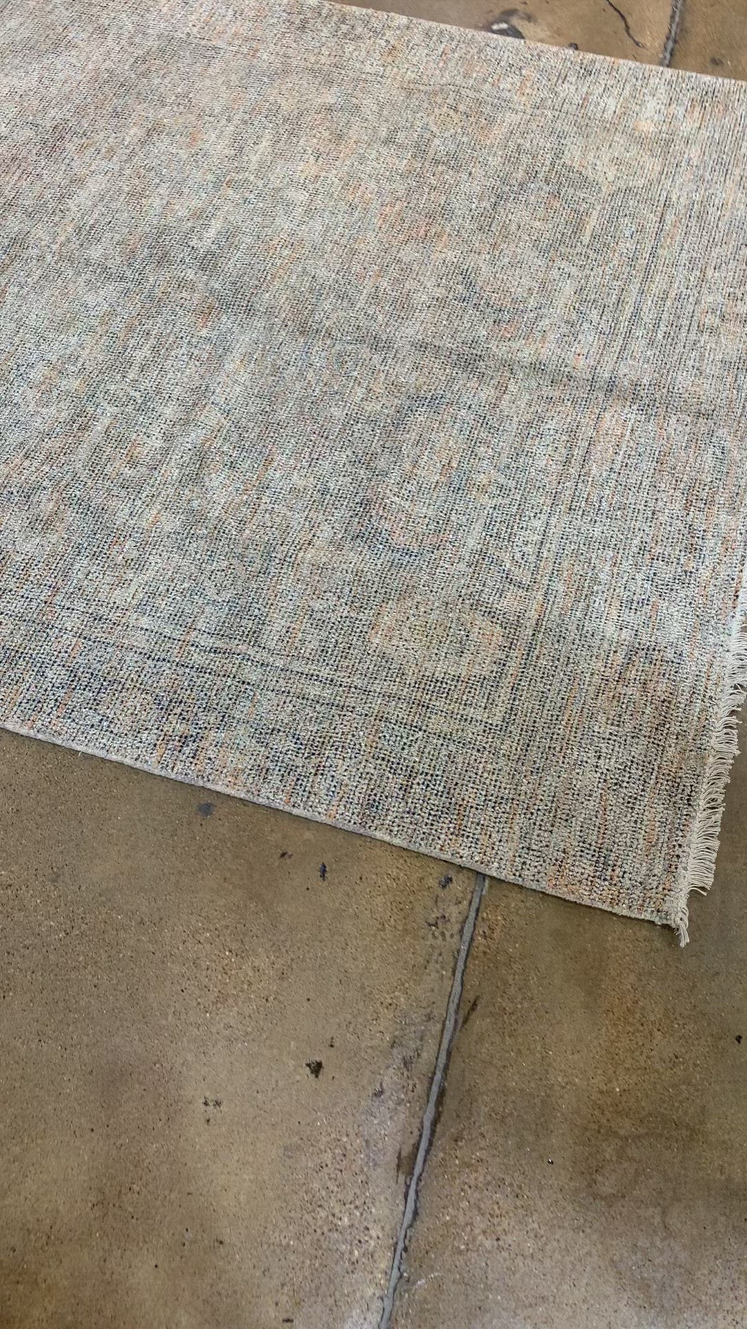 Load video: Hand-woven by skilled artisans, the Priya Olive / Graphite Area Rug from Loloi offers beautiful tonal designs accentuated by a carefully curated color palette. Delicate yet strong, Priya is an instant classic made for today&#39;s home.  Hand Woven 51% Cotton | 29% Polyester | 12% Viscose | 8% Wool PRY-03 Olive/Graphite Colors: Brown, Gold, Ivory, Blue