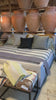 We love the maple wood base of this Laurel Bed by Cisco Brothers. A cozy, chic piece to add to your bedroom to immediately elevate the space. Photographed in Molino Blush. Amethyst Home provides interior design, new home construction design consulting, vintage area rugs, and lighting in the Winter Garden metro area.