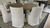 The Craig Dining Chair is featured in a gorgeous white linen slip cover in a Belgian wrinkle.   LINEN FABRIC AND BIRCH FRAME WHITE Size: 19"l x 23"d x 35"h Seat Height: 20"h