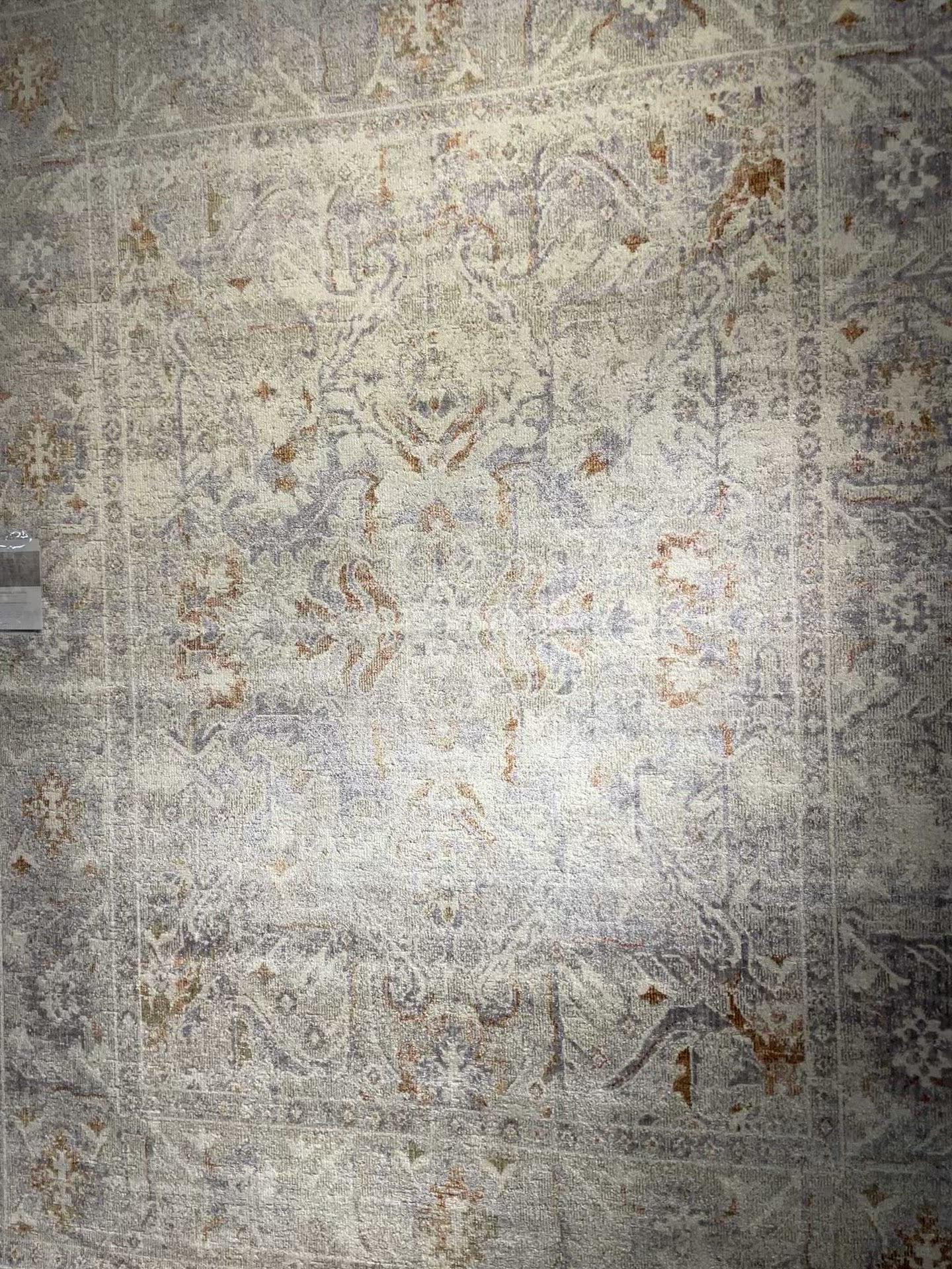 Durable, low pile, and soft, this rug is inspired by classic vintage and antique rugs. The Rosemarie Chris Loves Julia Oatmeal / Lavender ROE-05 rug from Loloi features a beautiful vintage pattern and patina. The rug is easy to clean, never sheds, and perfect for living rooms, dining rooms, hallways, and kitchens!