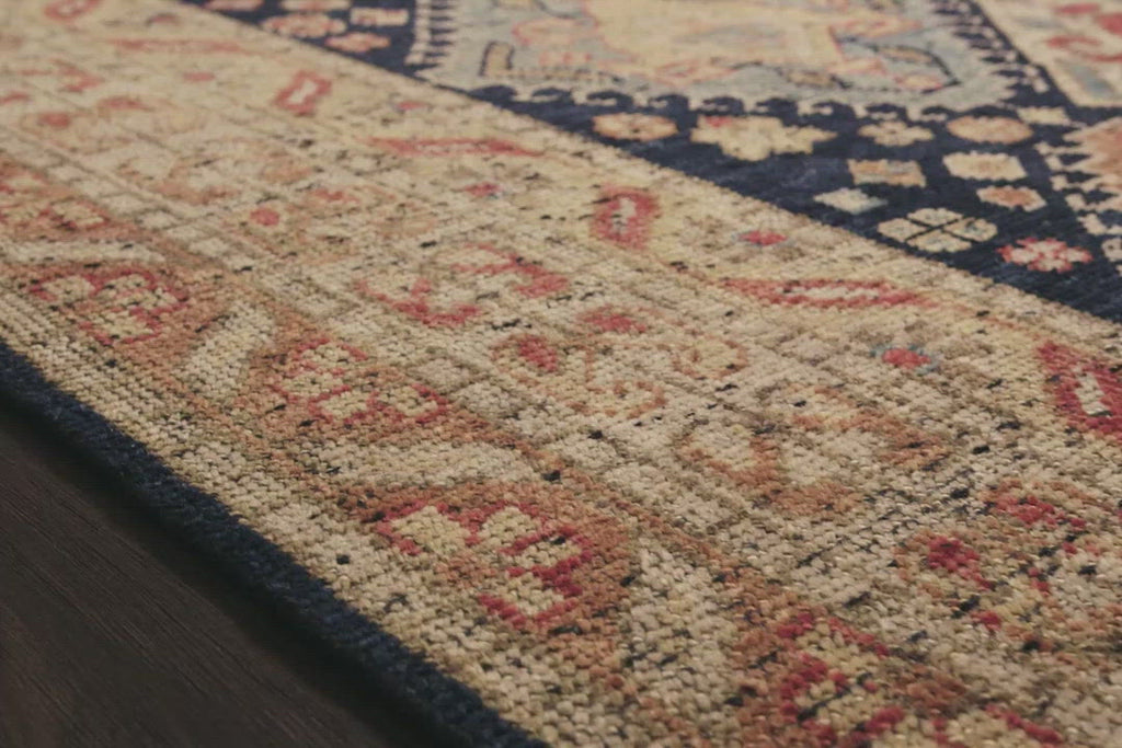 Bring a touch of antiqued beauty into your home with our Heirloom collection. This 100% wool collection tastefully honors the art of hand knotted rugs from India. Heirloom evokes a sense of unique sophistication with its traditional Serapi rug color palettes and vintage design.  Hand Knotted 87% Wool | 13% Cotton HQ-01 Navy/Multi