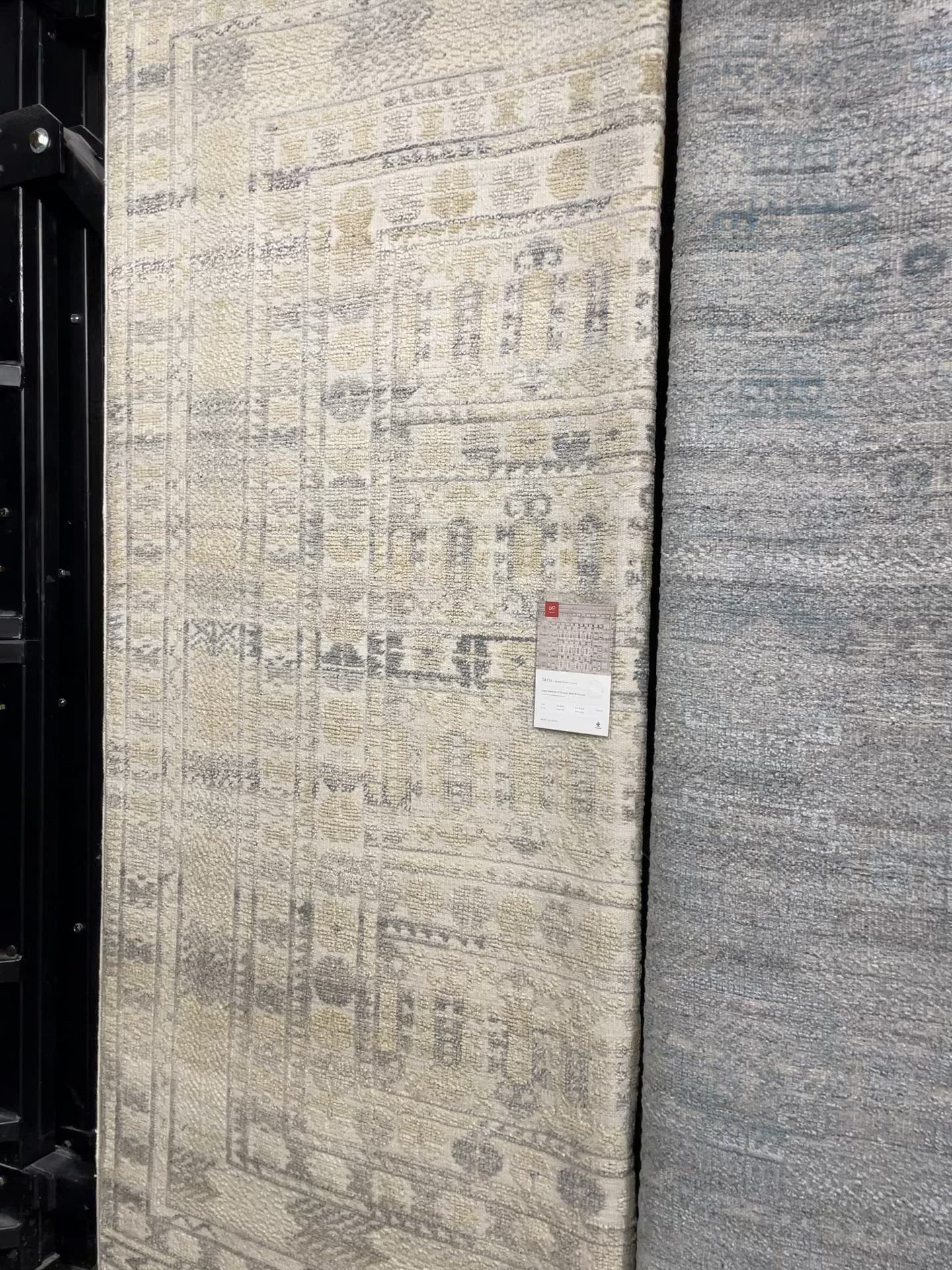 Load video: The Idris Ivory/Taupe area rug from Loloi is meticulously hand-knotted of viscose and wool. You will love this rug because the rug is:  Perfect for entryways, living rooms, and bedrooms Easy to clean and maintain Gorgeous with the intricate pattern and patina Warms up any room with the high / low pile Hand-Knotted 70% Viscose | 30% Wool ID-04 Ivory/Taupe